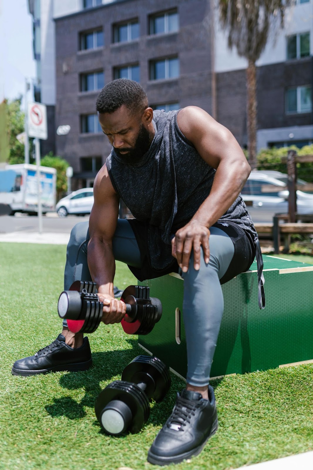 a man lifts weights on a sunny day – BUILT Bar