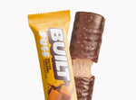 A BUILT salted caramel puff shown inside and outside of the wrapper on a white background.