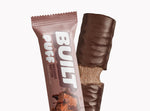 A BUILT brownie batter puff shown both inside and outside of the wrapper on a white background.