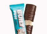 A BUILT coconut puff shown inside and outside of the wrapper on a white background.