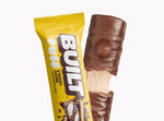 A BUILT s'mores chunk puff bar shown inside and outside of the wrapper on a white background.