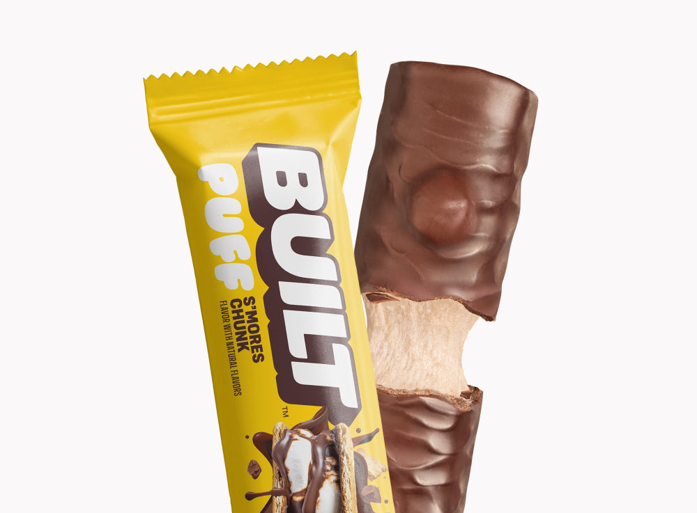 A BUILT s'mores chunk puff bar shown inside and outside of the wrapper on a white background.