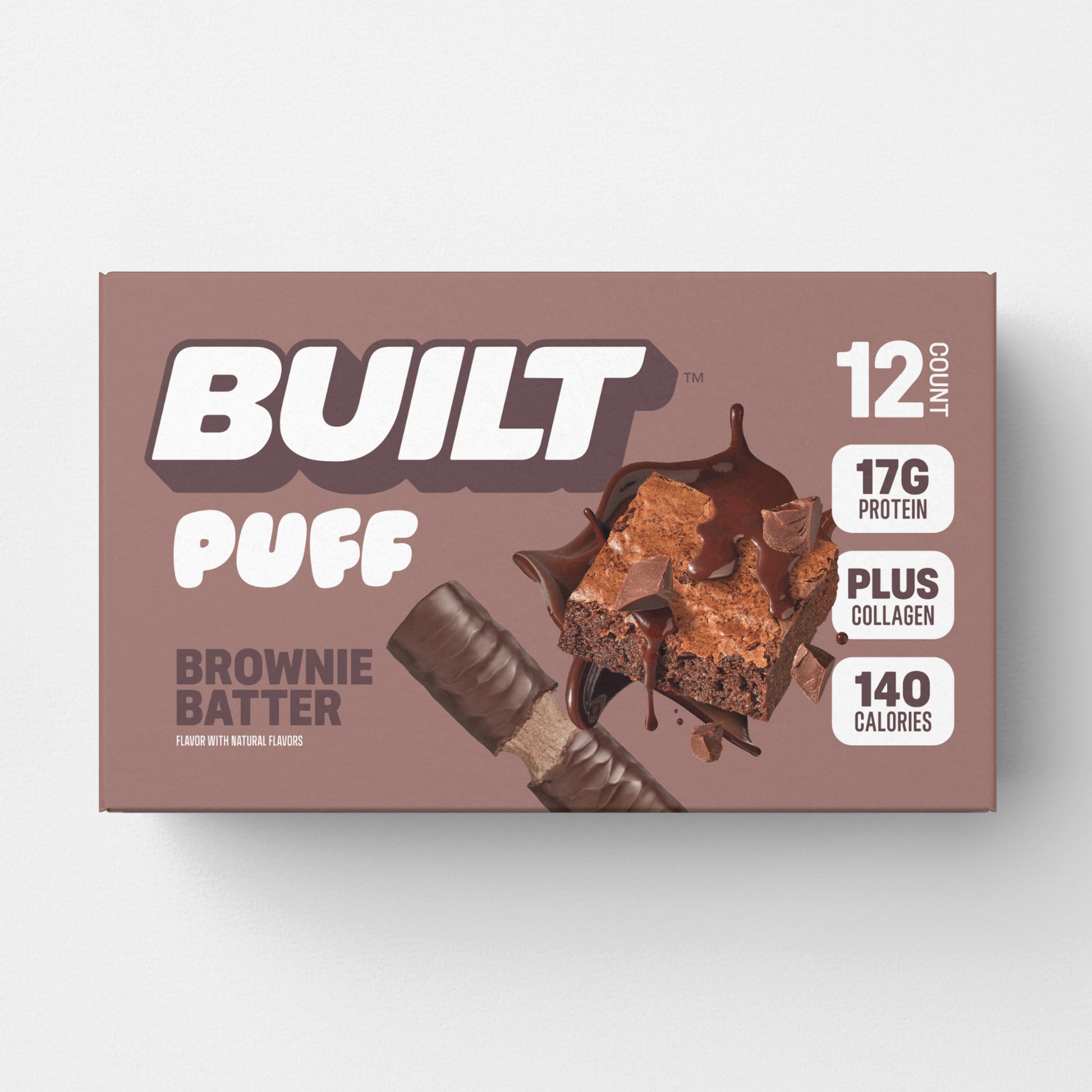 A 12 count, light brown box of BUILT brownie batter puffs on a white background.