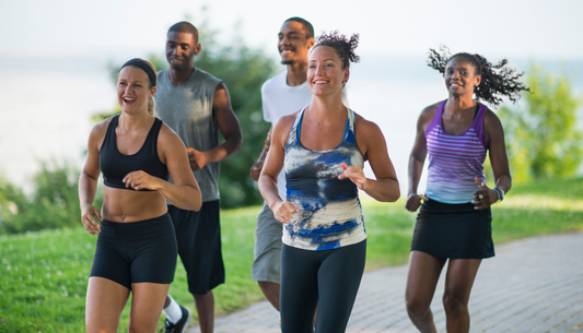 group of runners on a run together outdoors