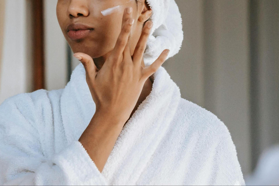 a woman applies a collagen face mask – BUILT Bar
