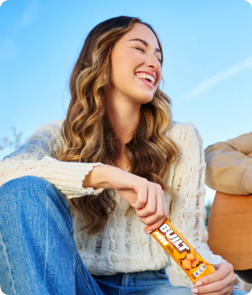 girl laughing and socializing about to eat a BUILT puff