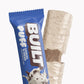 A BUILT cookies and cream puff shown both inside and outside of the wrapper on a white background.