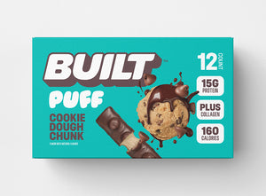 A teal box of BUILT cookie dough chunk puffs on a white background.
